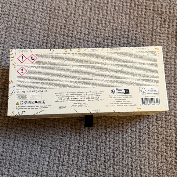 Diptyque Candle Trio with Vibrant Patterns - Picture 2 of 3